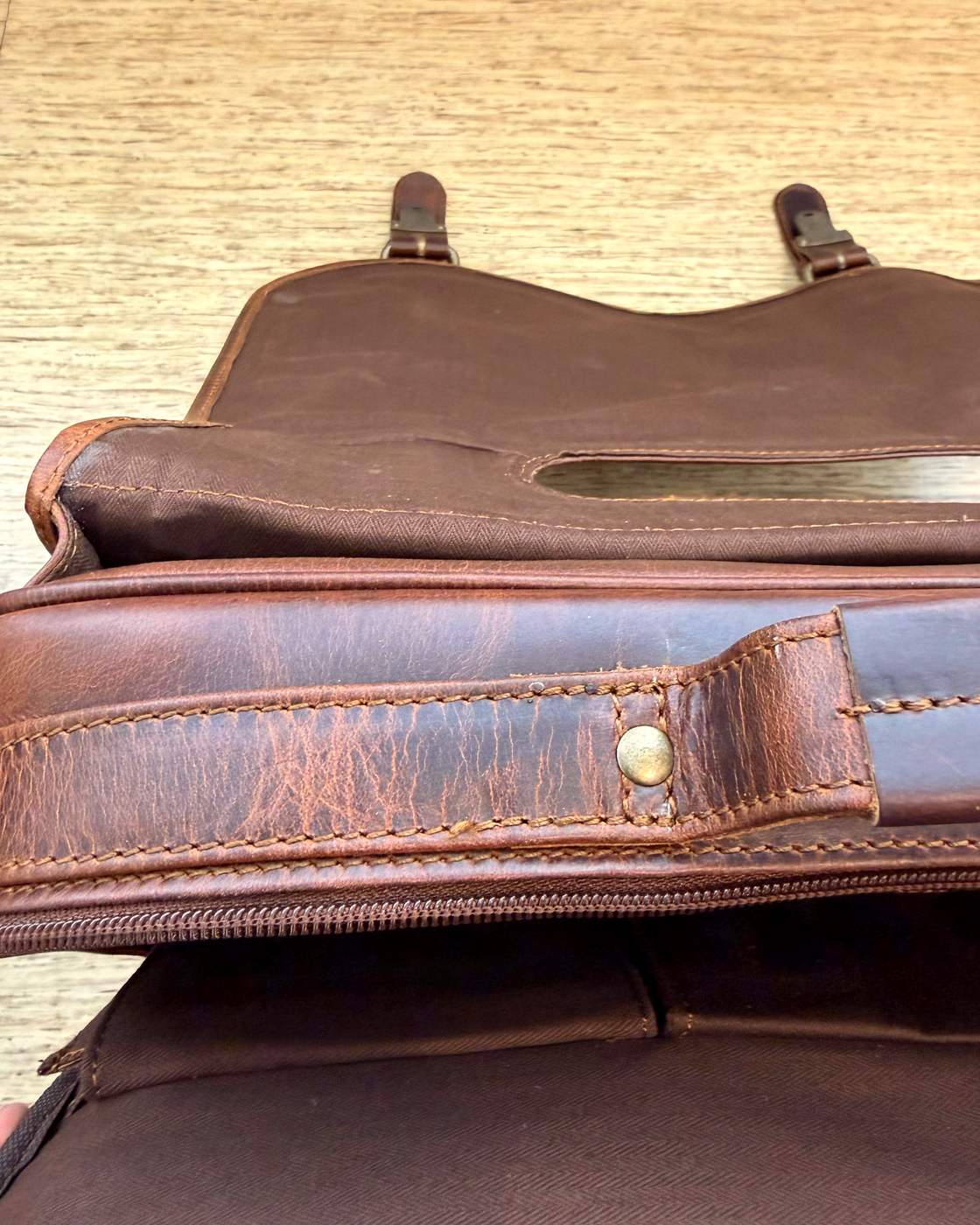 Real photo of The Messenger with the flap lifted showing the underside and keepers