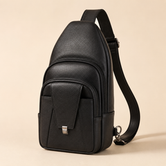 Bellvari Metro sling backpack in Black full-grain leather, front three-quarter view with the clasp-flap pocket — view 2