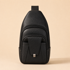 Front of the Black Metro sling backpack, showing the main zip, the front zip pocket and the clasp-flap pocket — view 10