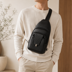Man wearing the Black Metro sling across his chest over a cream sweater — view 13