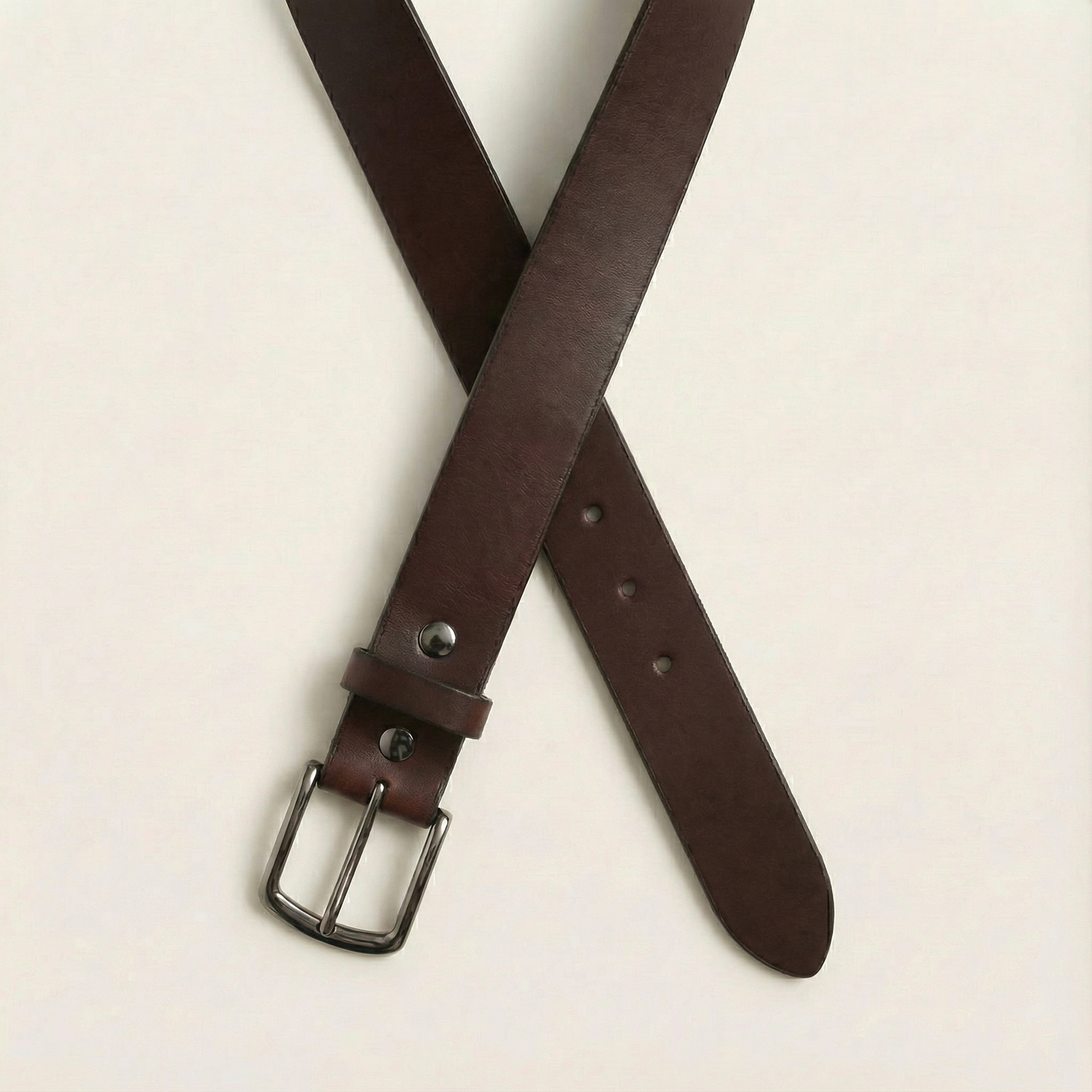 Bellvari Nightfall black leather belt close-up of gunmetal buckle.