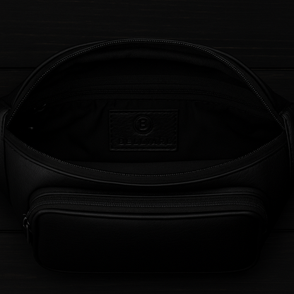 Black backpack with a visible brand logo on a dark background