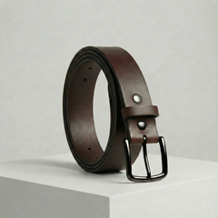 Bellvari Nightfall black full-grain leather belt with brushed gunmetal buckle on a neutral background. — view 1