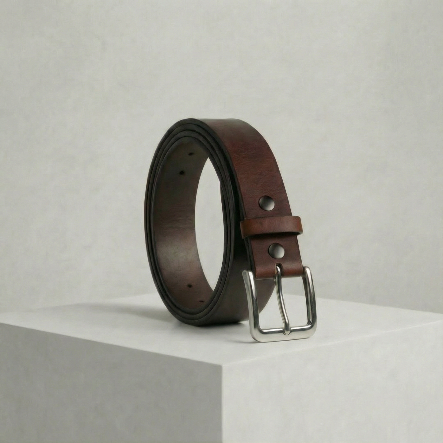 Bellvari Trailblazer crunch full-grain pull-up leather belt with satin-nickel solid-brass buckle on a neutral background.