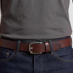 Bellvari Forge leather belt rolled, showing distressed full-grain finish. — view 3