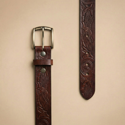 Bellvari Ironhide leather belt detail of hand-tooled floral pattern.