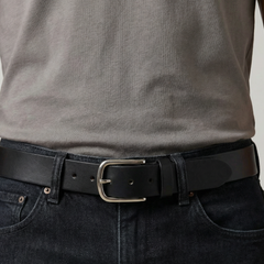 Bellvari Maverick jet-black full-grain leather belt photographed in natural light, single un-split strip with brushed steel buckle. — view 3