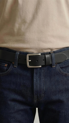 Man wearing the Bellvari Tradesman black full-grain leather belt with denim jeans, brushed steel buckle. — view 3