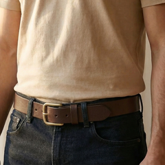 Man wearing the Bellvari Tradesman brown full-grain leather belt with dark jeans, brass buckle. — view 3