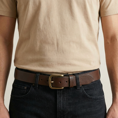 Man wearing the Bellvari Tradesman brown full-grain leather belt with dark jeans, brass buckle. — view 6