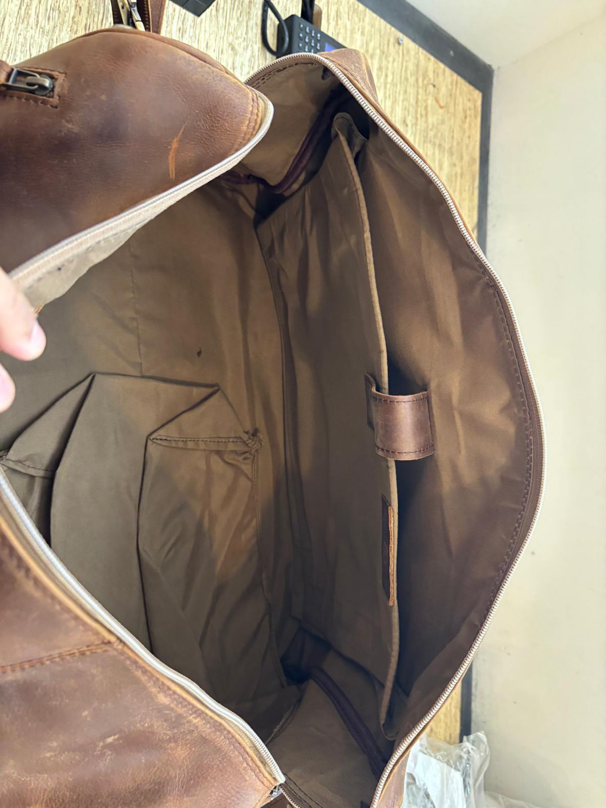 The Crazy Horse Brown Weekender held open, showing its interior, lining and internal pockets.