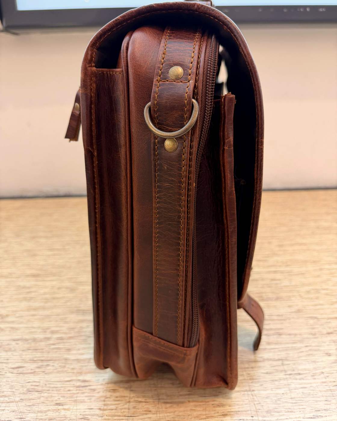 Real photo of The Messenger side profile and strap anchor